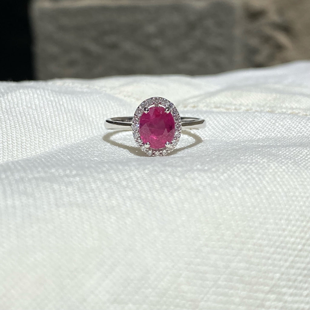 Ring in 18K White Gold with Oval Ruby and Diamond Halo