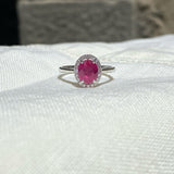 Ring in 18K White Gold with Oval Ruby and Diamond Halo