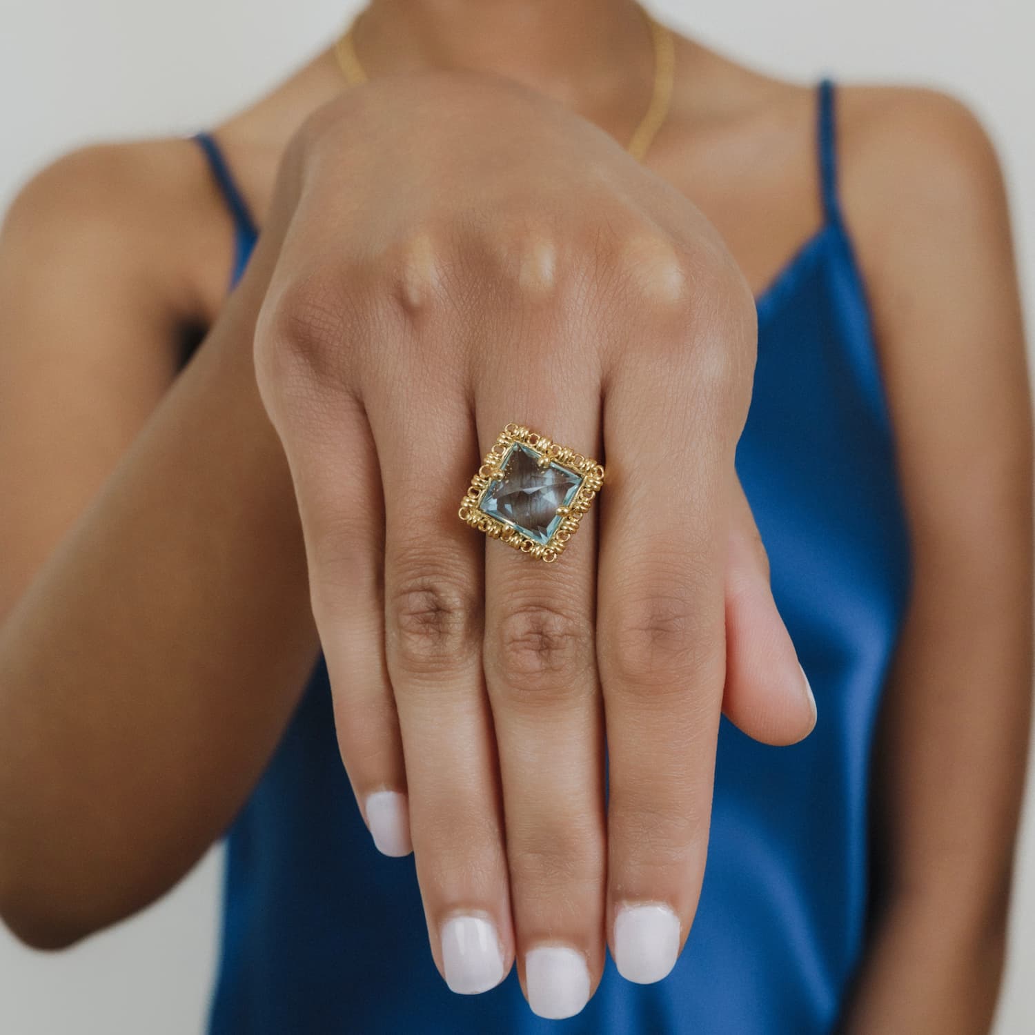 Quadra Ring in Gold with Blue Topaz
