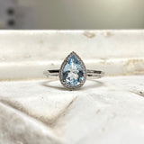 Ring in 18K White Gold with Pear Aquamarine and Diamond Halo